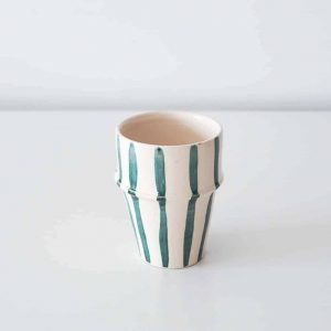white and teal cup