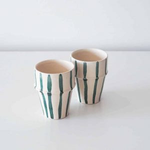 white ceramic cup teal stripes