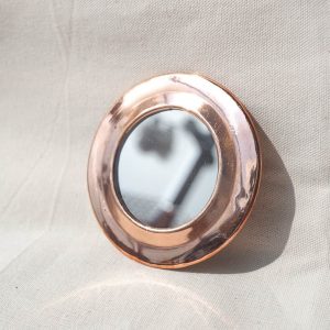 round copper mirror