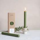 a box of st eval olive green dinner candles with a ella bua candlestick