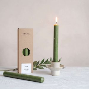 a box of st eval olive green dinner candles with a ella bua candlestick