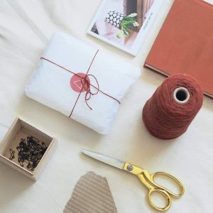 flat lay of gift packaging and wrap we are nomads