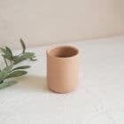 soft salmon pink argilo ceramic cup on table cloth