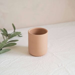 soft salmon pink argilo ceramic cup on table cloth