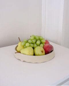 ceramic bowl made by eradu with overflowing fruit