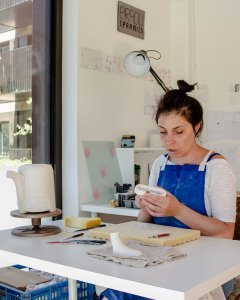 eva the ceramicist owner of eradu making a ceramic handle