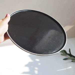 showing the glossy finish of naked clay plate we are nomads
