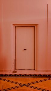 1930s art deco pink door at villa serralves in porto we are nomads