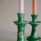 a close up of a green candlestick made in morocco in the village of tamegroute