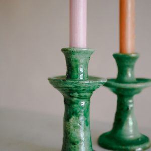 a close up of a green candlestick made in morocco in the village of tamegroute