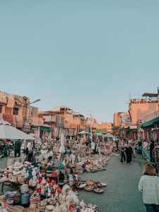 marrakech spice market square with lots of vendors selling baskets