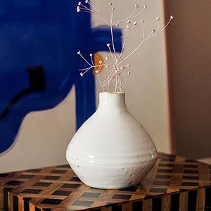 Glossy small white vase made from ceramics in Marrakesh Morocco